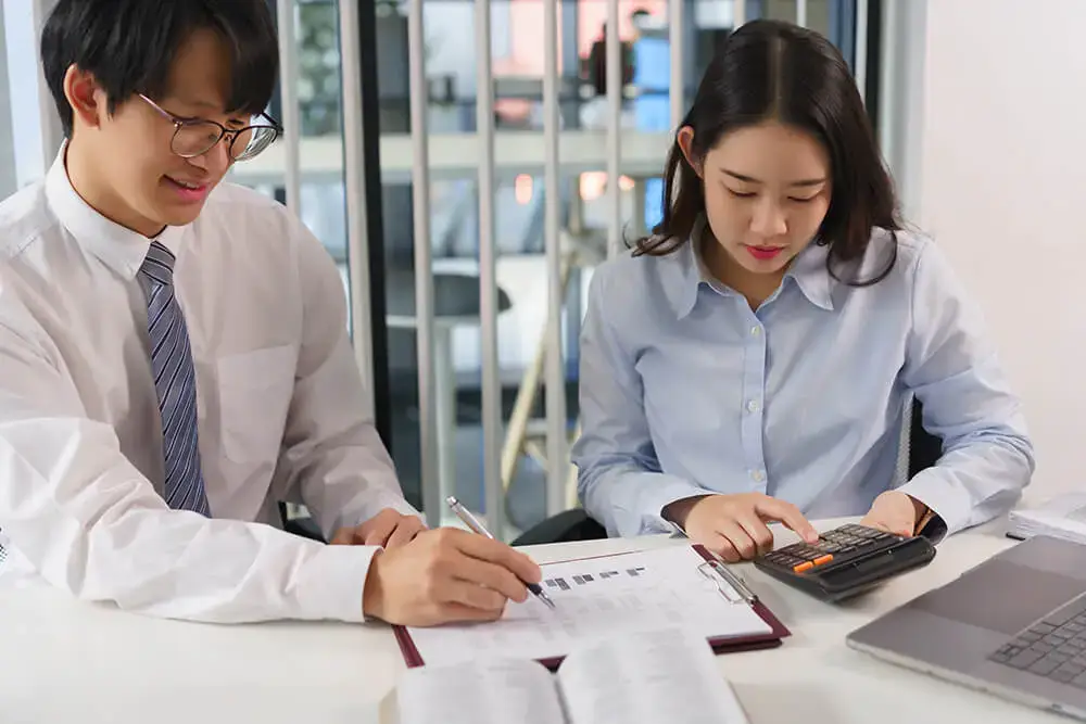 two accountants working as payroll attorney, monthly payroll computation, Thailand legal services