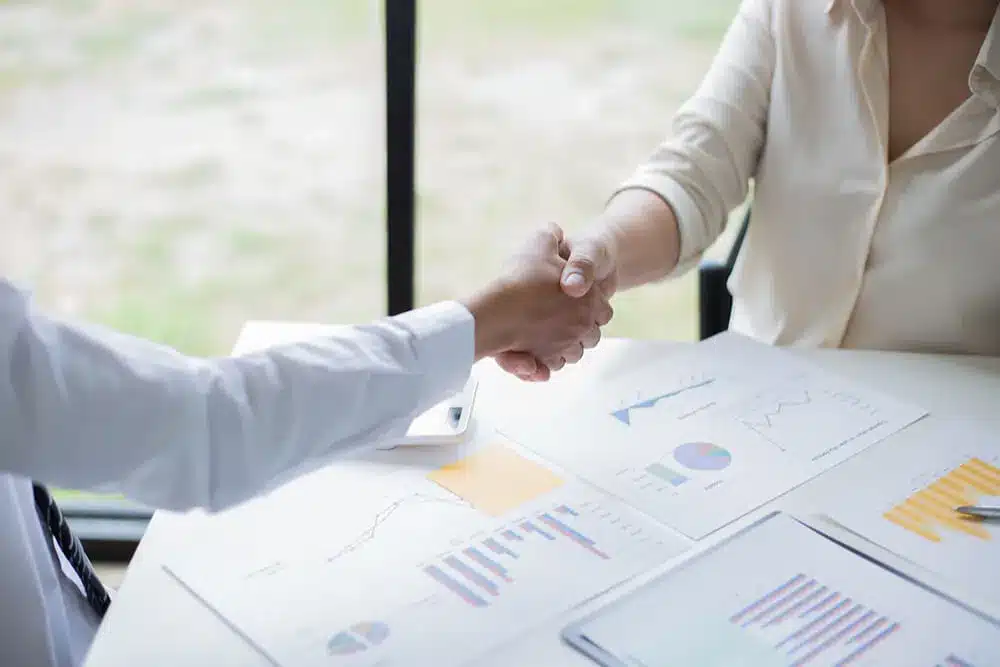 Two businessman Shake hand after deal. Thai us treaty of amity